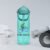 A Bespoke Bikeways branded CamelBak water bottle in Cove Blue color sits amongst workout gear in a typical product display.