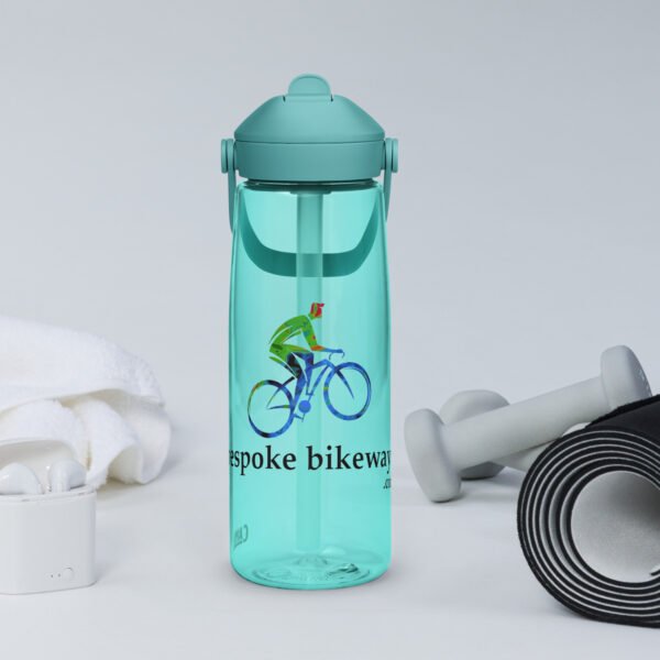 A Bespoke Bikeways branded CamelBak water bottle in Cove Blue color sits amongst workout gear in a typical product display.
