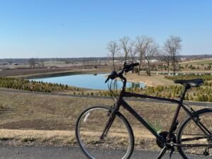 A bicycle sits overlooking the Christmas tree farm near Eckert's Orchard.