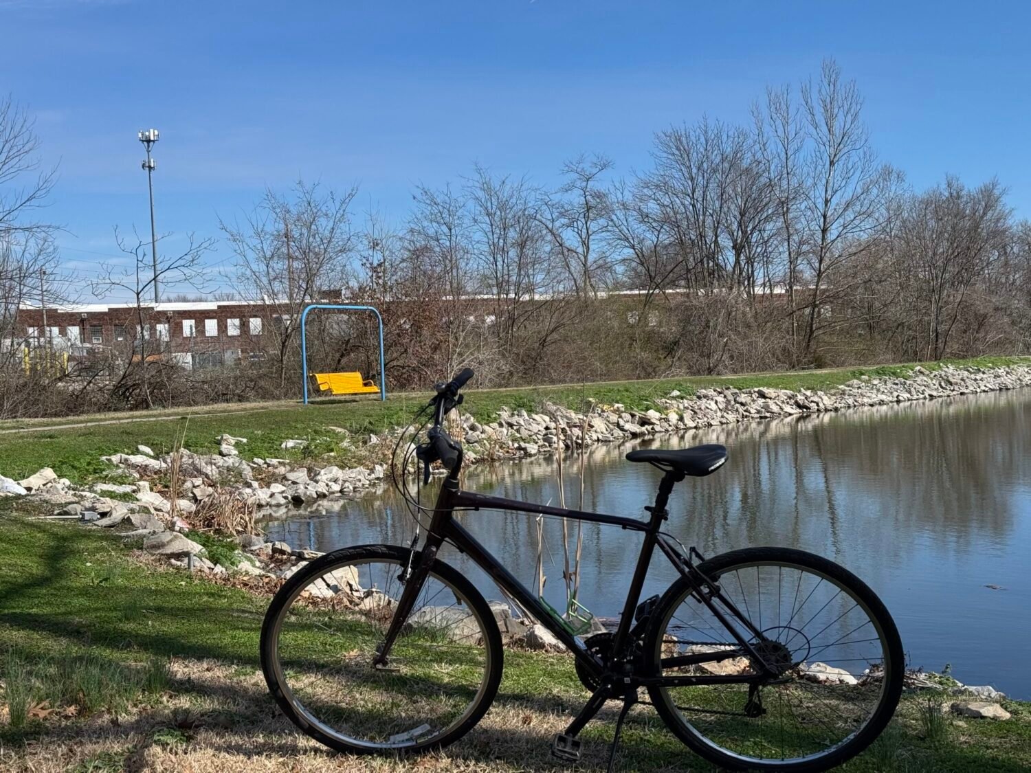 A bicycle sits next to the pond at Southside Park off the Richland Creek Greenway in Belleville, IL
